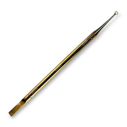 Gold-colored tool with a pointed end on a white background