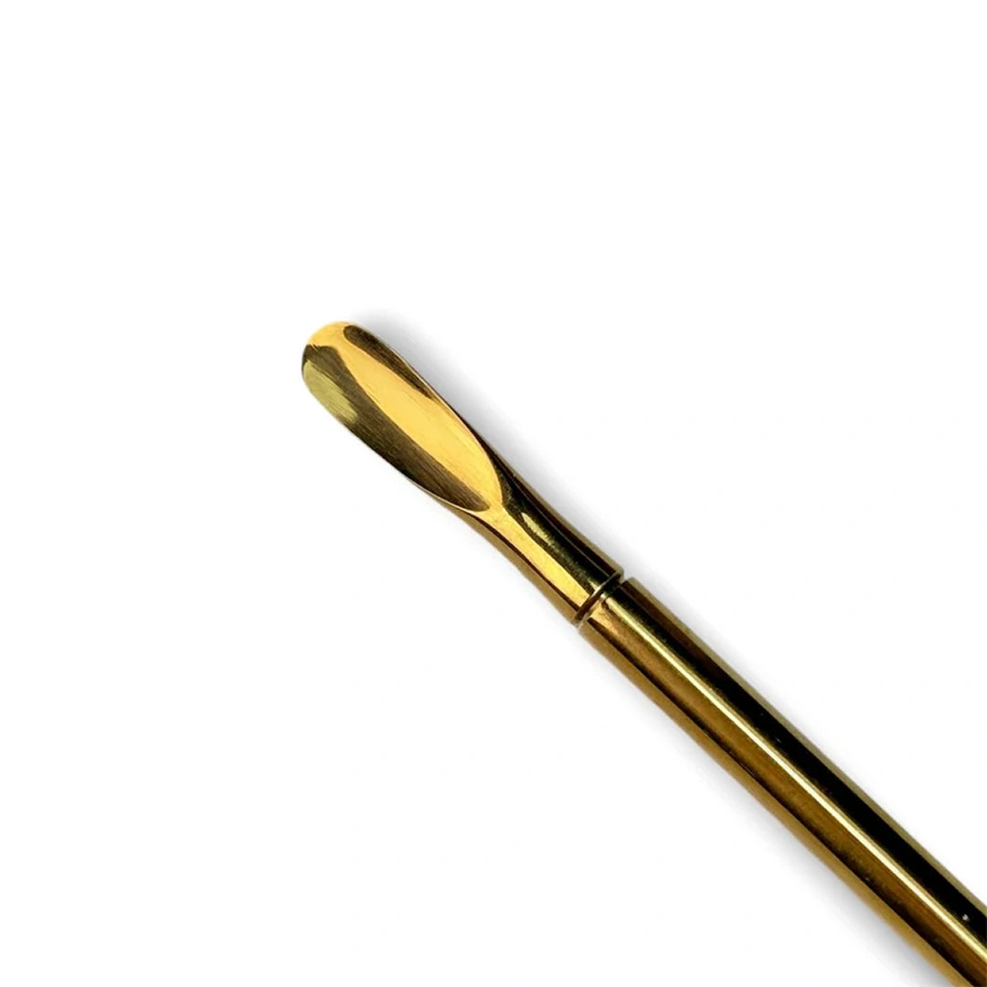 one side of a gold metal double ended cuticle pusher