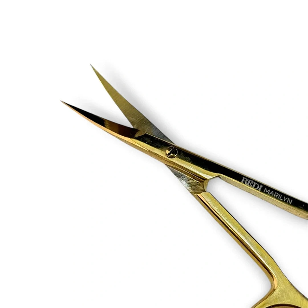 Gold scissors with 'REDI MARILYN' branding on a white background
